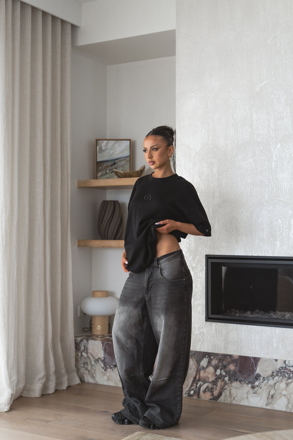 Classic Tee in black on a female model, raised tonal monogram at the chest - Grails Apparel 260gsm heavyweight oversized tee