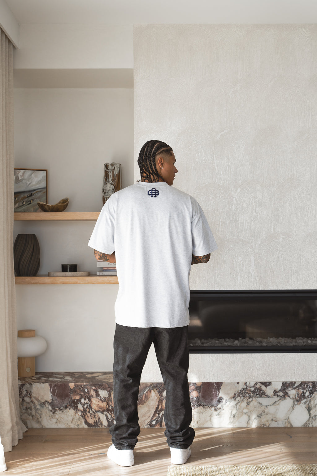 Varsity Tee in snow marle worn back-on, navy 3D puff monogram at the back of the neck - Grails Apparel 260gsm heavyweight tee