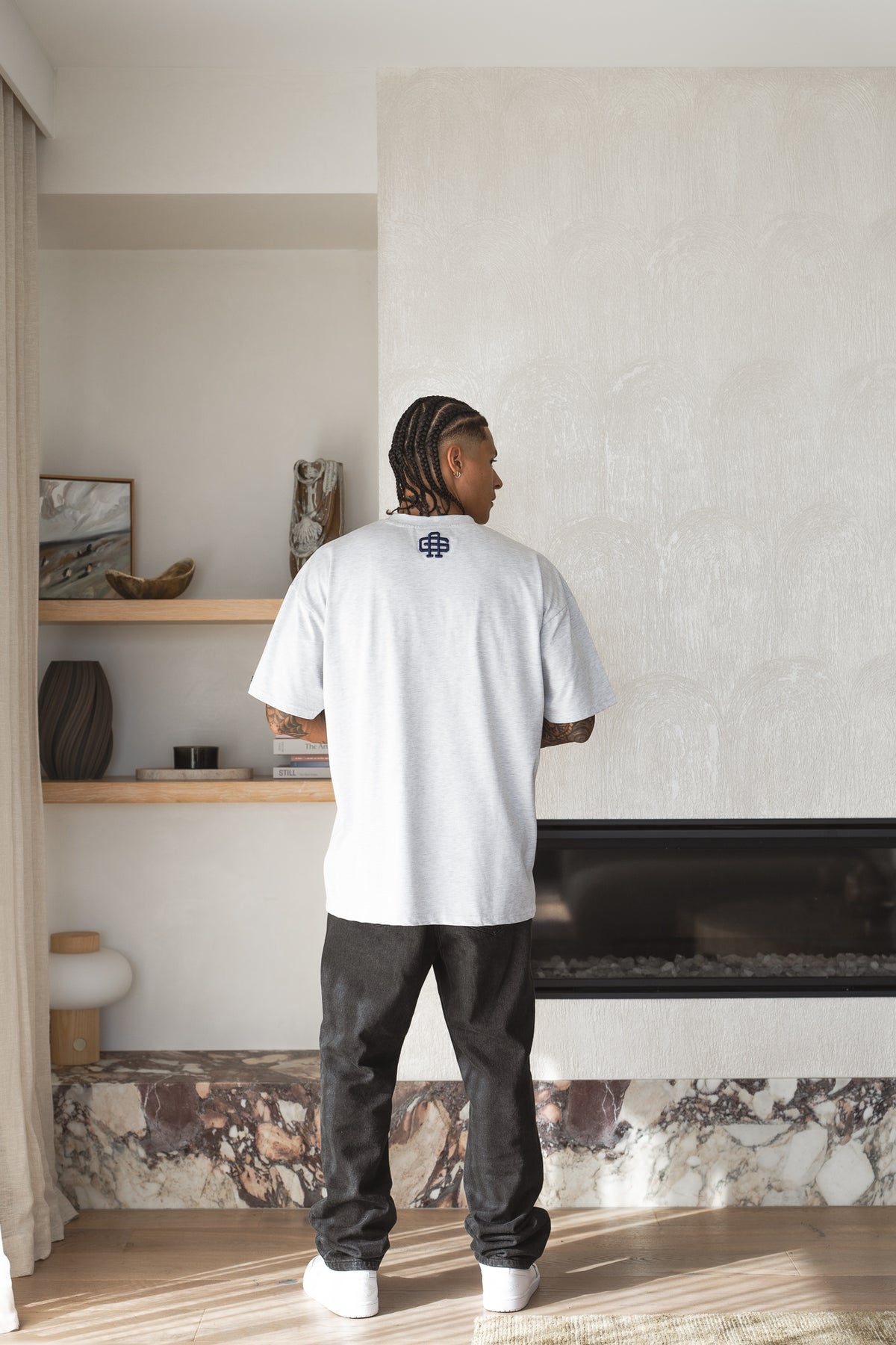 Varsity Tee in snow marle worn back-on, navy 3D puff monogram at the back of the neck - Grails Apparel 260gsm heavyweight tee